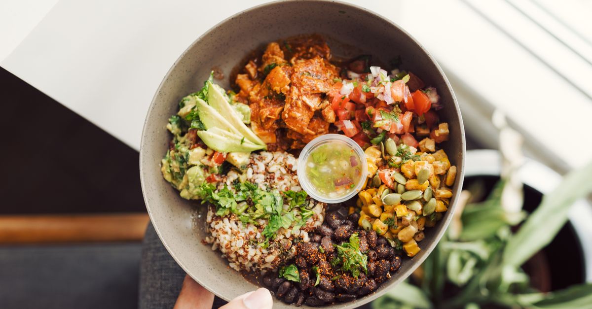 Colorful quinoa and avocado bowl with fresh tomato salsa
